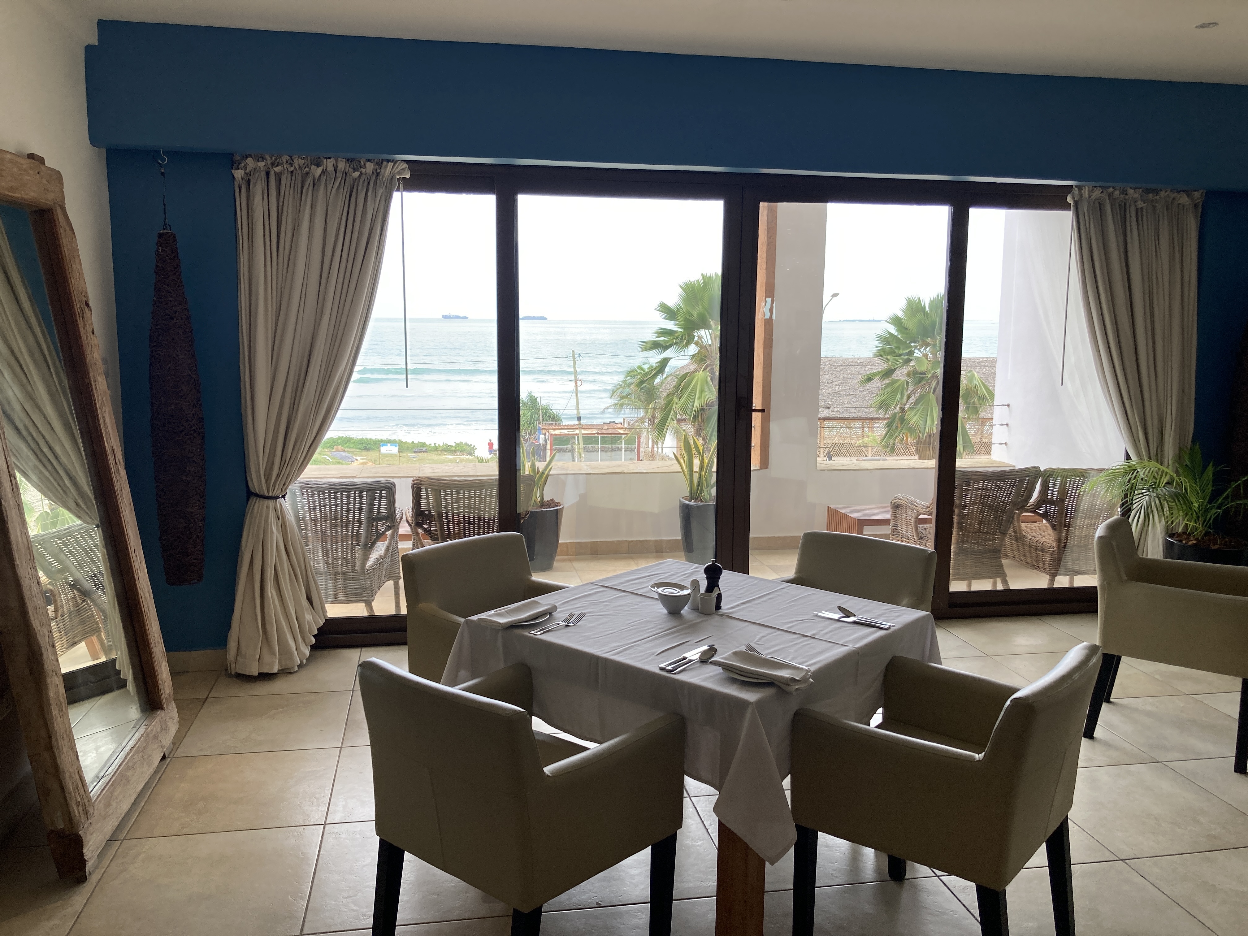 Dining area of Wimbi Restaurant at The Oyster Bay Hotel Suites